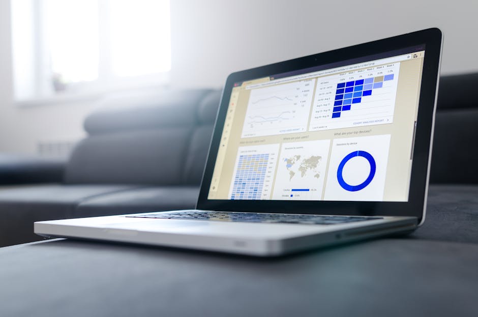 Sleek laptop showcasing data analytics and graphs on the screen in a bright room